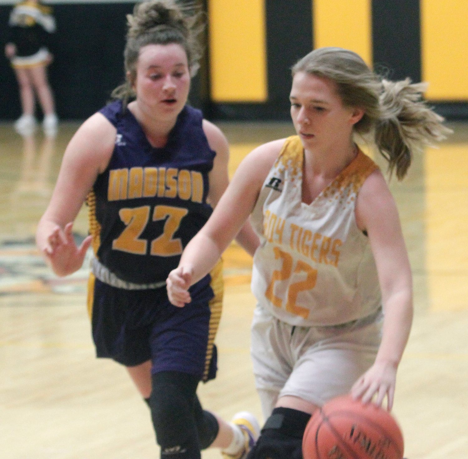 Higbee Lady Tigers junior guard Macey Whisenand dribbles past a Madison player during last Monday's opening round game of the Class 1 District 10 tournament that Higbee won. The Lady Tigers season ended Wednesday with a 69-23 loss to Community of Laddonia in the district semifinal. Whisenand led her team with six points scored.