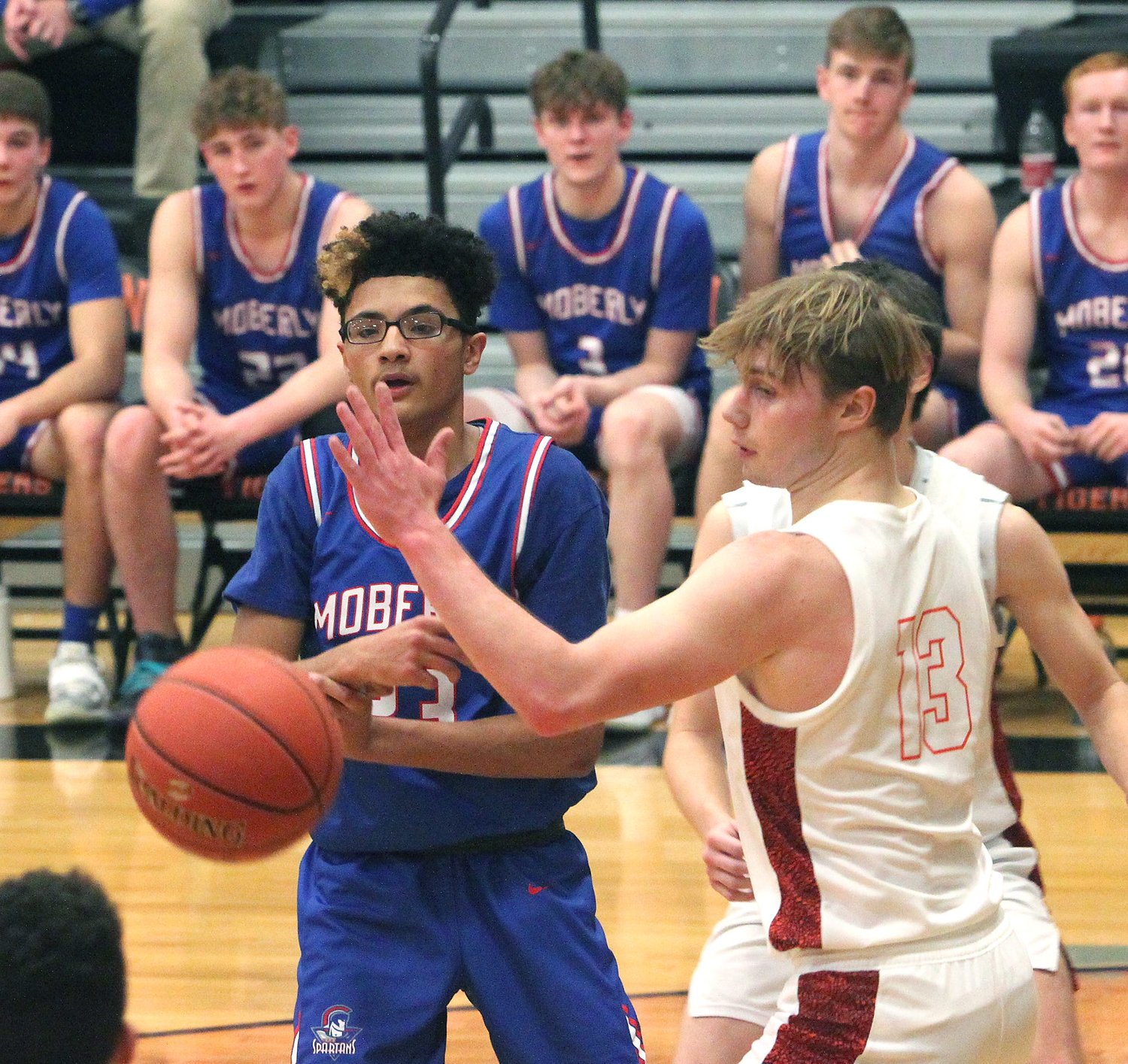 Moberly High School junior Martez Nabors (dark jersey) and the Spartan boys basketball team lost 81-45 Tuesday at Mexico.