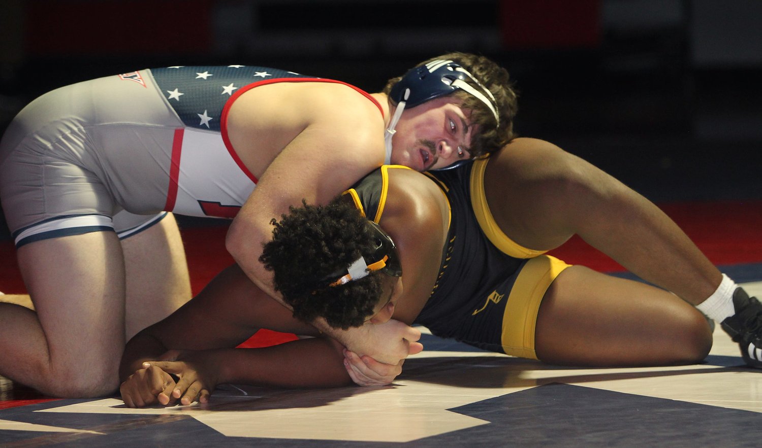 Moberly junior Beau Garrett leans on top of his 195-pound opponent, Fulton's Ja'Dontae Ray, during a home triangular meet held Tuesday. Garrett finished off Ray winning a 6-1 decision and the Spartans team secured a 39-34 dual victory as well.