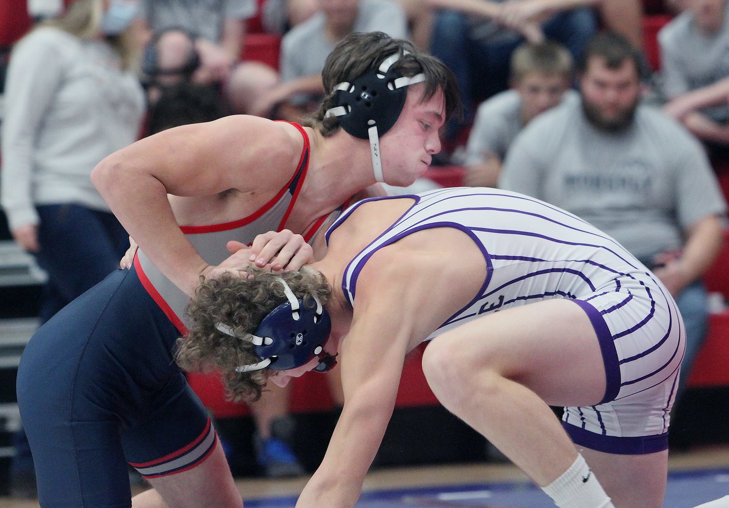 Moberly 138-pound wrestler Gage St. Clair (left) lost his Tuesday match to a Mexico wrestler by a technical fall, and the Spartans team returned home with a tough 40-39 loss.