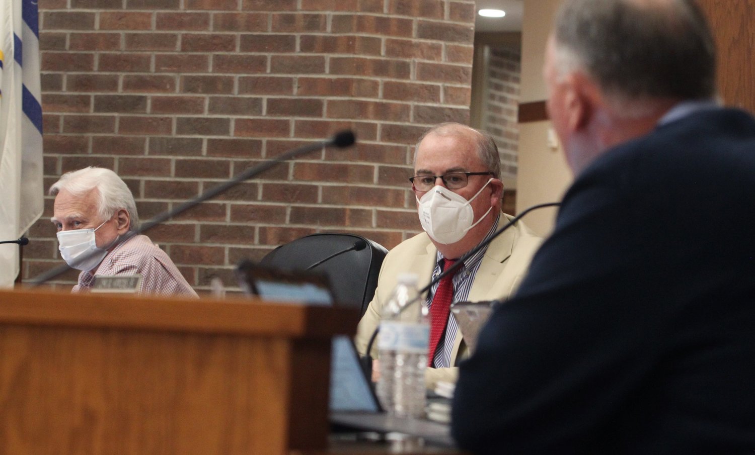 Moberly Mayor Jerry Jeffrey, middle, and councilman Tim Brubacker, left, listen to comments being made by councilman Cole Davis, right, during Monday's city council business meeting.