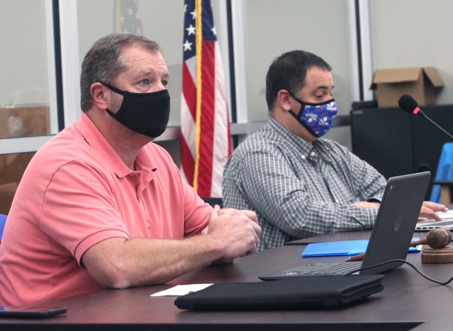 Moberly Public School Board President Bobby Riley (left) talks about a revised COVID-19 guideline document proposal issued by the Randolph County Health Department during a Tuesday, Nov. 10 school board meeting. Sitting to the right is Superintendent Dr. Tim Roling.
