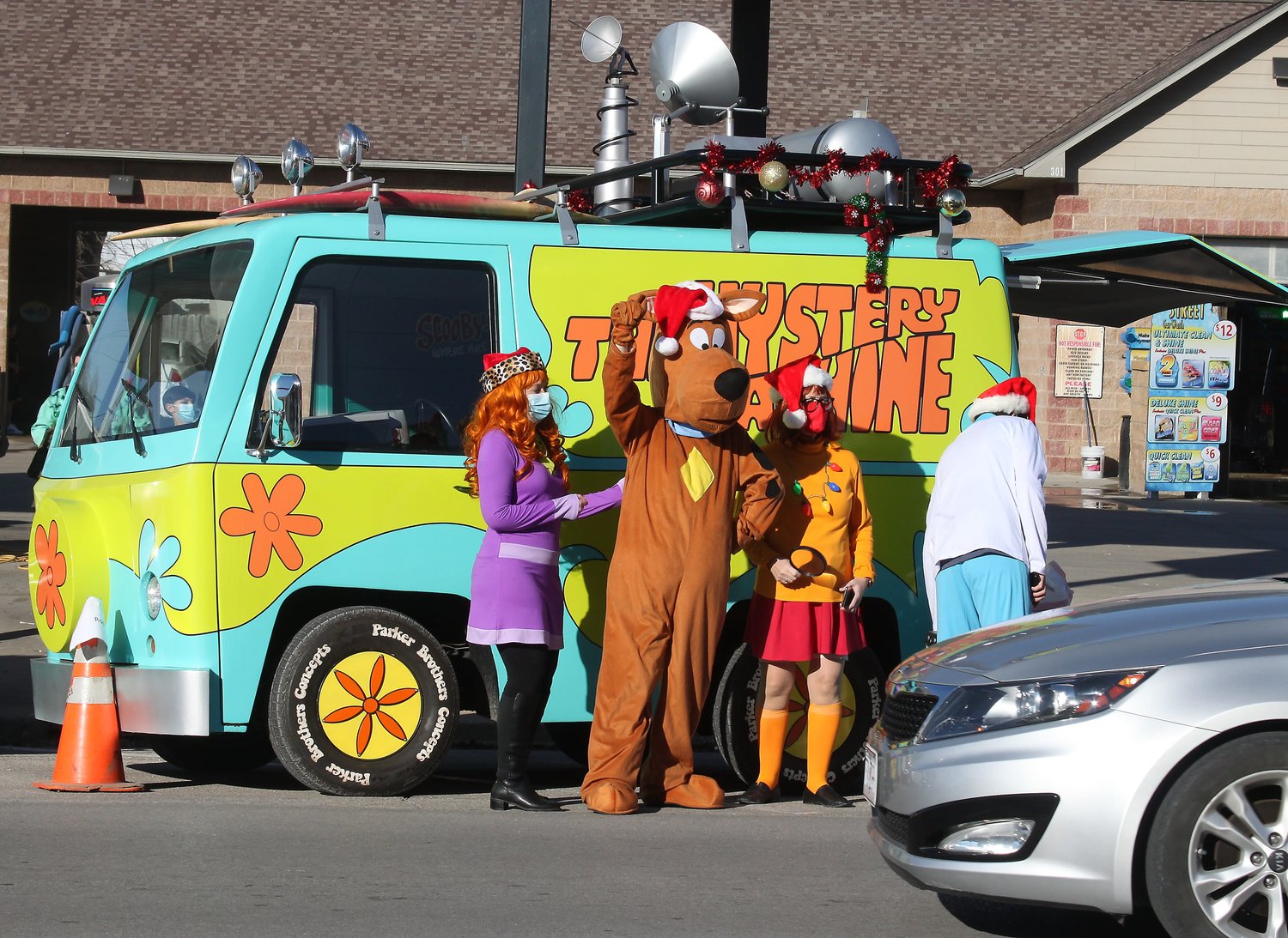&lt;br /&gt;
&lt;strong&gt;Children&amp;#39;s cartoon character Scooby Doo waves at a motorist while fellow costumed characters Velma and , right, and Daphne, left, stand with Scooby in front of the Mystery Machine van. The display was one of about 9 entries in Moberly&amp;#39;s 2020 Reverse Christmas Parade held Dec. 5 in the downtown business district. Due to COVID-related restrictions, the event forced organizers to have motorists drive by and persons to walk by to see the parade entries in lieu of a traditional motorcade and march through the Reed and Coates streets.&lt;/strong&gt;&lt;br /&gt;
&lt;br /&gt;
(Photos by Chuck Embree)