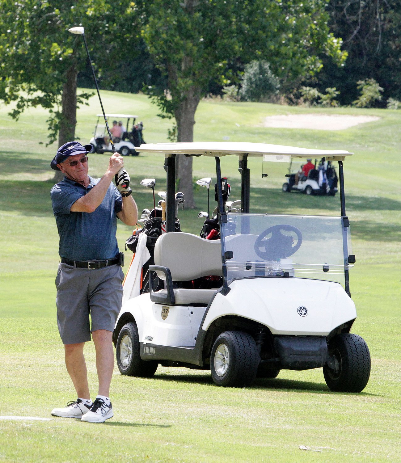 Charlie Fulks of Moberly follows through with his swing on a shot place toward Hole No. 2, Monday, Aug. 30 at Heritage Hills Golf Course. Fulks was among golfers from 28 4-person teams that took part in Moberly Area Community College's annual Cotton Fitzsimmons Memorial Golf Tournament. The event is a major fundraiser for MACC Greyhounds men and women's basketball programs.
