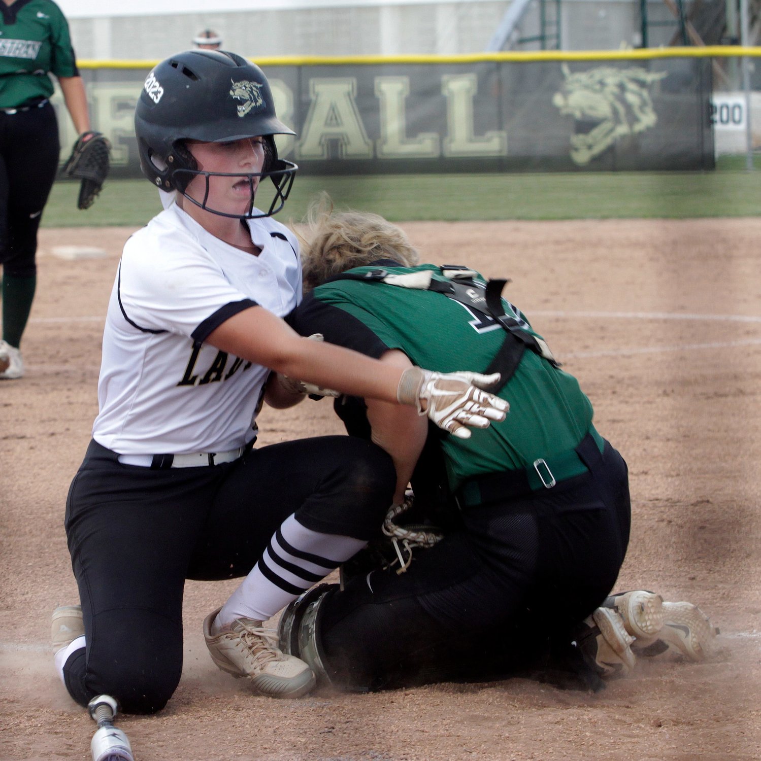 Westran High School senior catcher Bethany Dollich blocks home plate as she securely tags Cairo runner Gracie Brumley out in the bottom of the first inning Monday. Brumley tried to score from third base on an infield grounder, and the Lady Hornets from Huntsville topped Cairo winning 14-6.