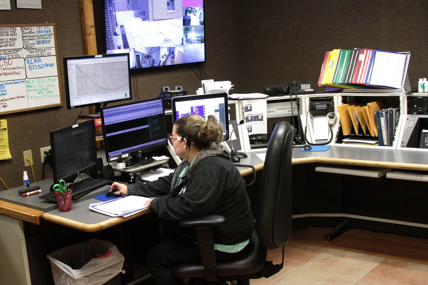 Dorothy Bailey, a telecommunications operator with the Moberly Police Department, works at the communications command center that also serves all of Randolph County as she responds to a citizen's phone call who is in need of an officer's assistance.