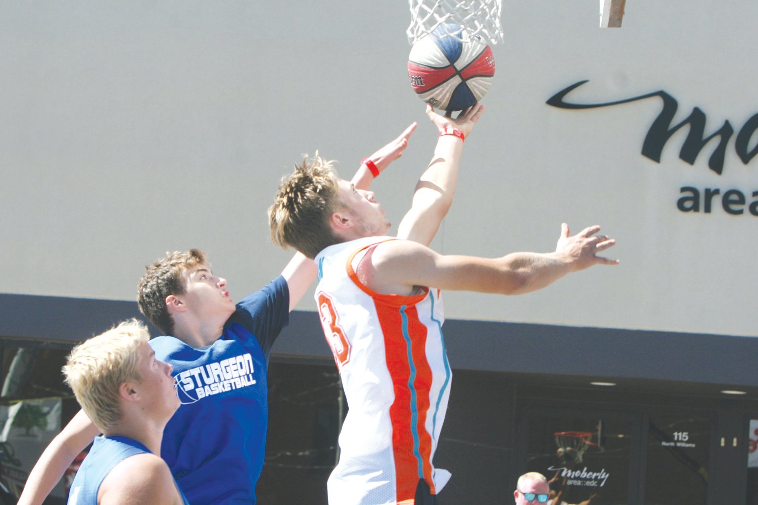 Carter Briscoe of Clark County goes for a layup during the Gus Macker 3-on-3 Basketball Tournament Saturday, Sept. 25, in Moberly. Theo Tate photo.