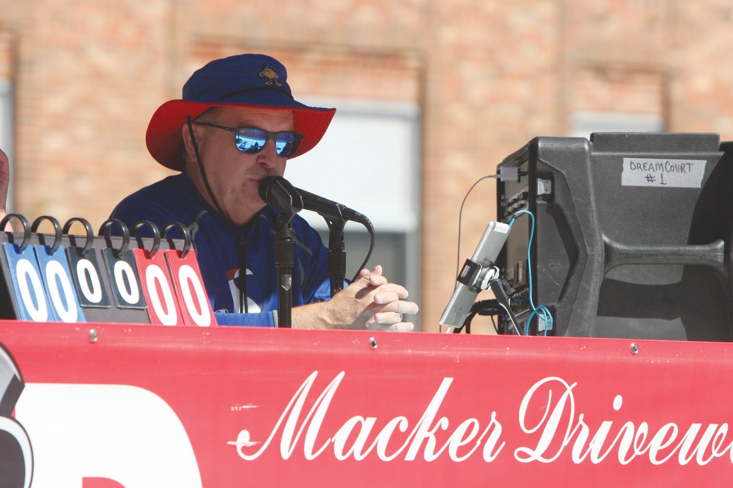 Scott McNeal does some announcing during a game at the Gus Macker 3-on-3 Basketball Tournament on Sept. 25 in Moberly. Theo Tate photo