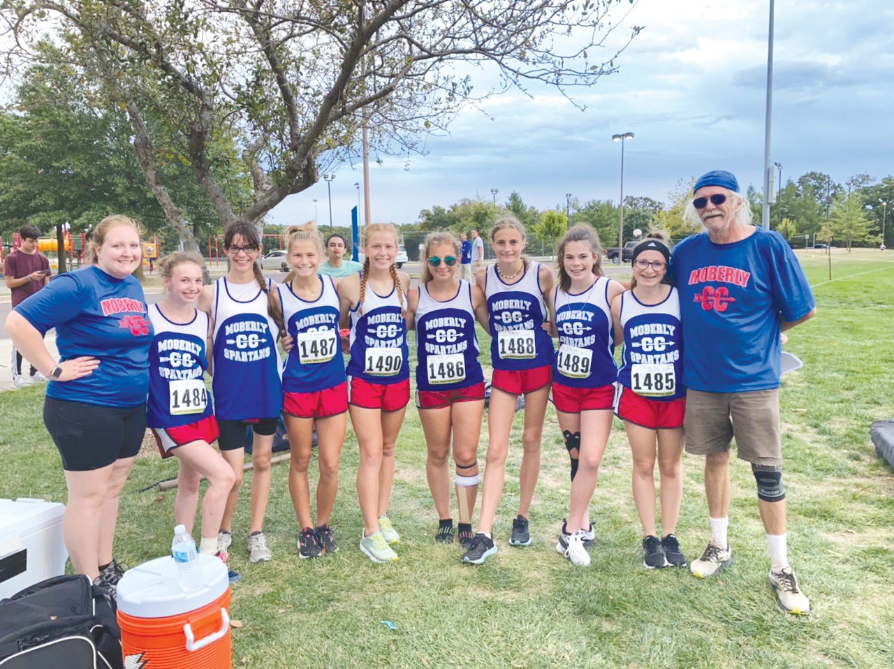 Pictured above are members of the Moberly girls cross country team that took first place at last week’s home meet. Pictured, from left, are Coach Brandi Colbert, Kadence Blair, Lily Barker, Anna Rivera, Arianna Wilkey, Marlana Pence, Chloe Ross, Faith Snodgrass, Whitney Fenton, Coach Greg Carroll. (Submitted photo)