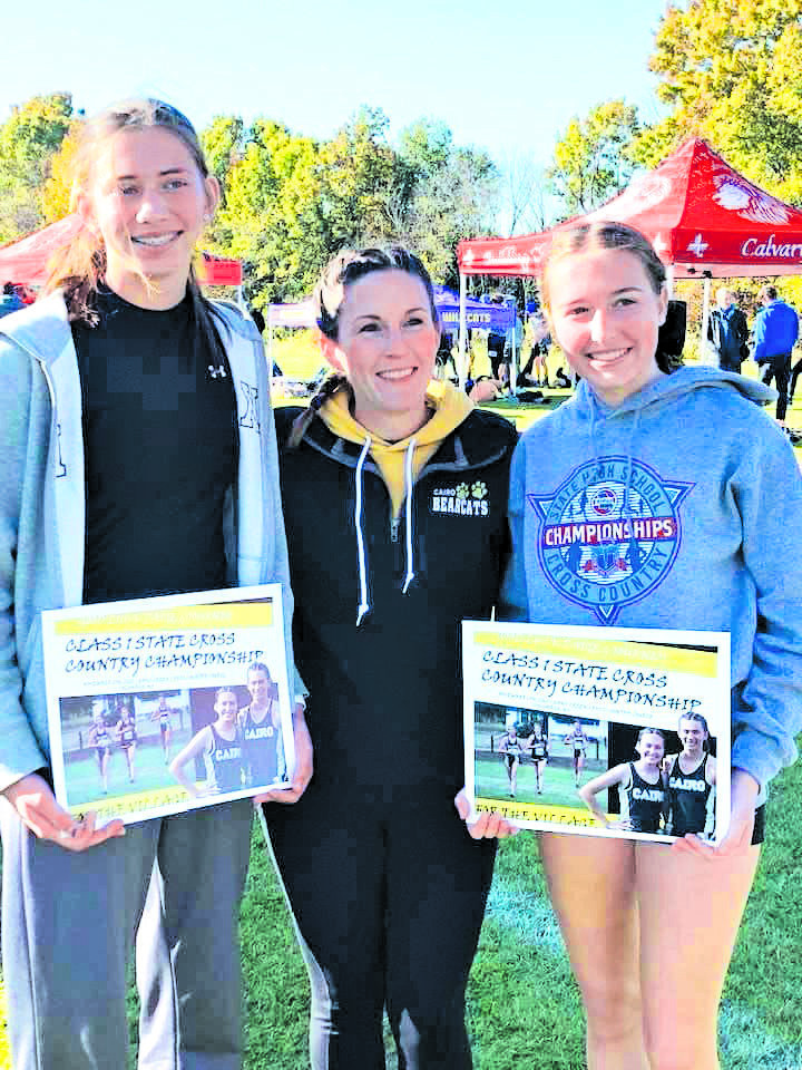 The Cairo duo of Journey Sander, left, and Paige Luntsford, right, competed at the Class 1 state cross country race Saturday. Alsopictured is Cairo coach Whitney Pate.