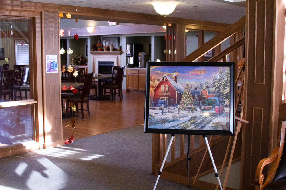 A framed Christmas puzzle greets visitors as they enter the lobby of the Meadow Ridge Nursing Home