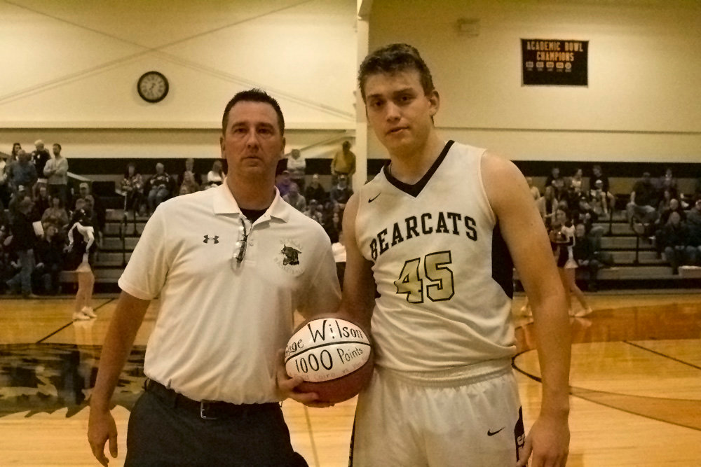 Before the game Tuesday night, Gage Wilson was presented the game ball where he scored his 1,000th-career point by coach Nic Zenker. Wilson scored his 1,000th point in the Bearcats win against Van-Far on Nov. 22. (All photos by Michael Allshouse)