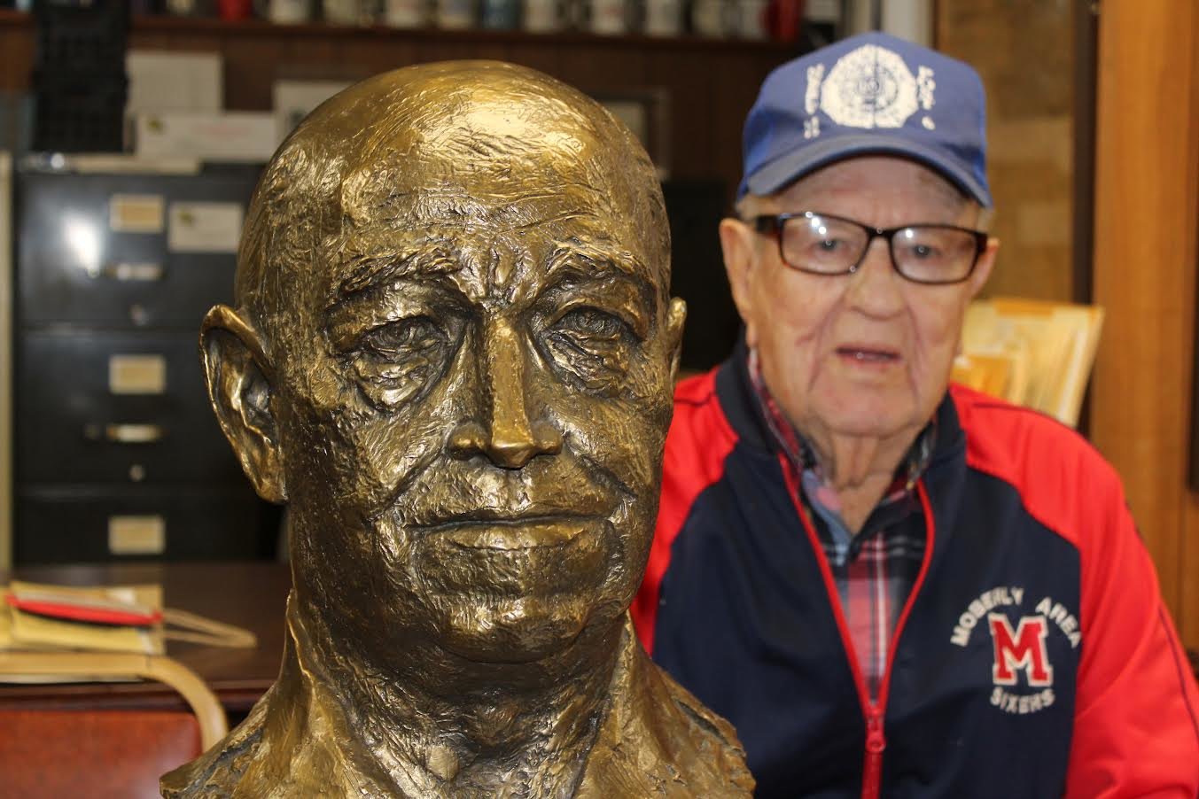 Veteran Donald P. Fuller, I, American Legion Post 6 finance officer, sits next to the bust of General of the Army Omar N. Bradley at the Randolph County Historical Museum & Genealogy Center. The bust was donated to the Randolph County Historical Society by The Chosin Few, survivors of the Battle of Chosin Reservoir (1950) during the Korean War. (Joe Barnes)