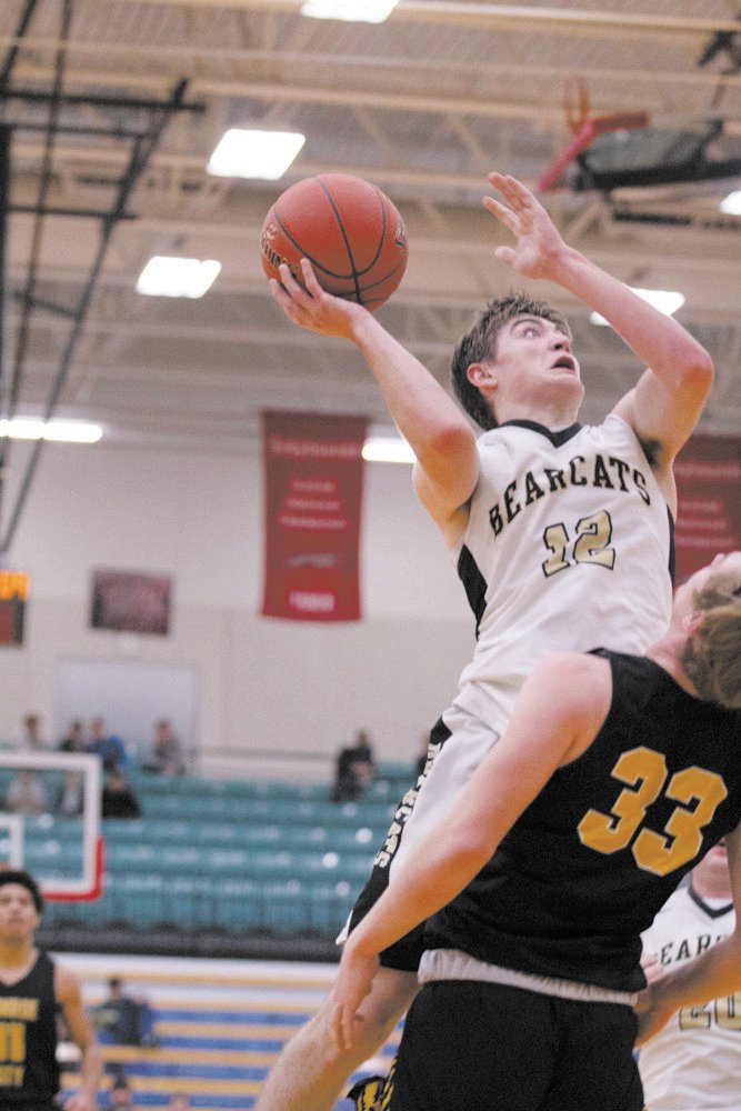 Cairo’s Justin Gittemeier goes up for the shot. Gittemeier led the Bearcats with 19 points in the loss to Monroe City.