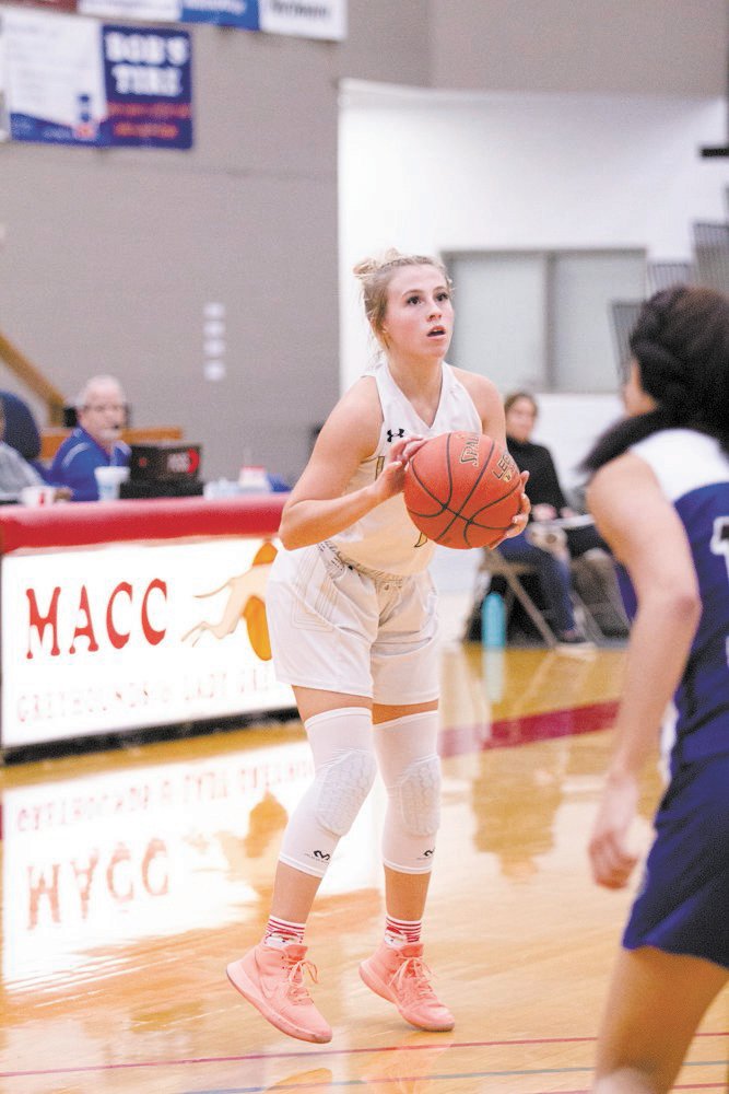 Gracie Brumley sets up behind the 3-point line. Brumley had a game-high 15 points, all 3-pointers for Cairo in its win.