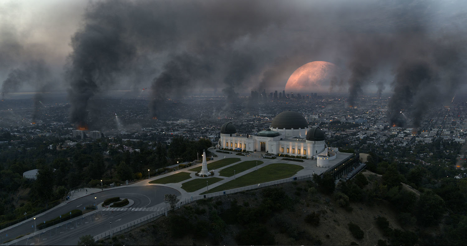 Fires, looting, and destruction across the Los Angeles skyline and Griffith Observatory as the Moon falls to the Earth in the sci-fi epic MOONFALL.