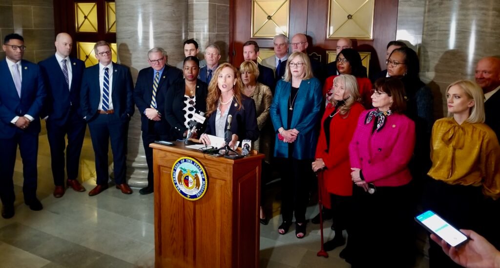 State Sen. Holly Thompson Rehder, surrounded by Republican and Democratic senators, speaks at a March 9, 2022, press conference. She accused the seven-member Senate conservative caucus of “self-interested bullying” to get its way on legislation. (Rudi Keller/Missouri Independent)