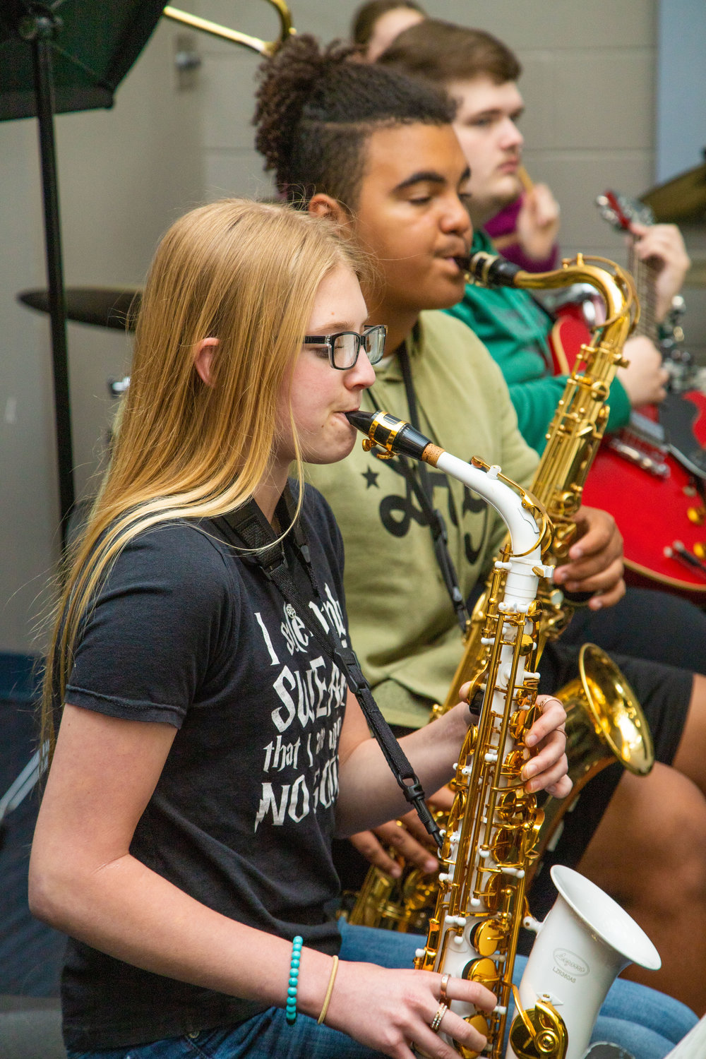 Nevaeh Cleeton and Javaughn Briscoe play sax during Moberly High School jazz band practice. The concert band will premiere a composition written in honor of former director Paul Copenhaver during Tuesday's concert.