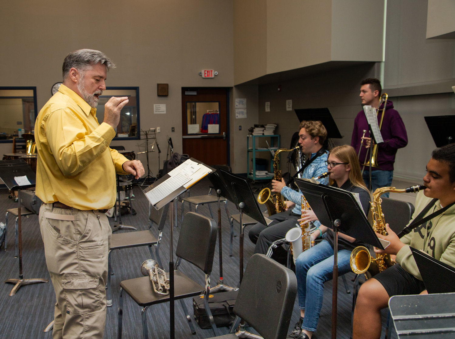 Jordan Perry directs the Moberly Area Jazz Bands in one of its final rehearsals of the year. Perry will step down as Moberly High School band director at the end of the school year to begin a job with Palen Music in Columbia.