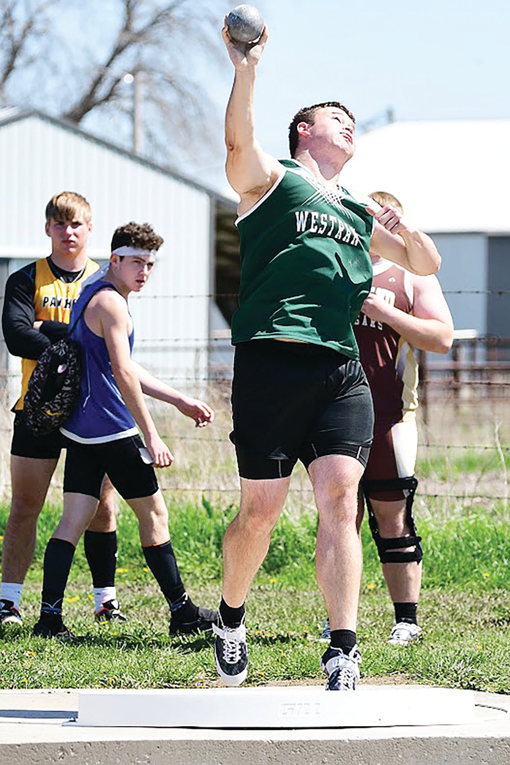 Westran’s Brenin Howell heaves the shot put during Saturday’s Class 2 District 3 meet at Putnam County High School in Unionville. Howell qualified for this week’s sectional meet with a mark of 15.4 meters.