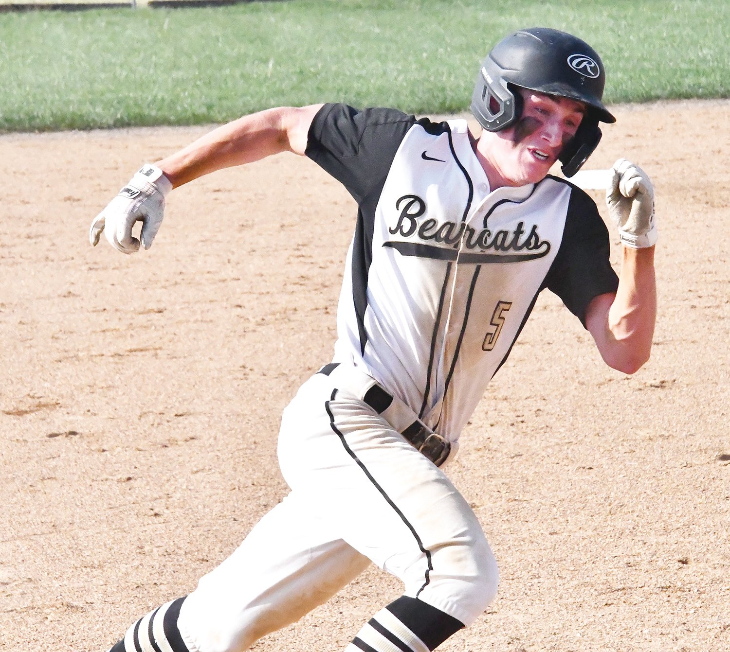 Cairo’s Logan Head (5) turns the corner at third base and heads for home with a run during Monday’s Randolph County showdown between the Bearcats and Westran. Cairo defeated Westran 9-2.