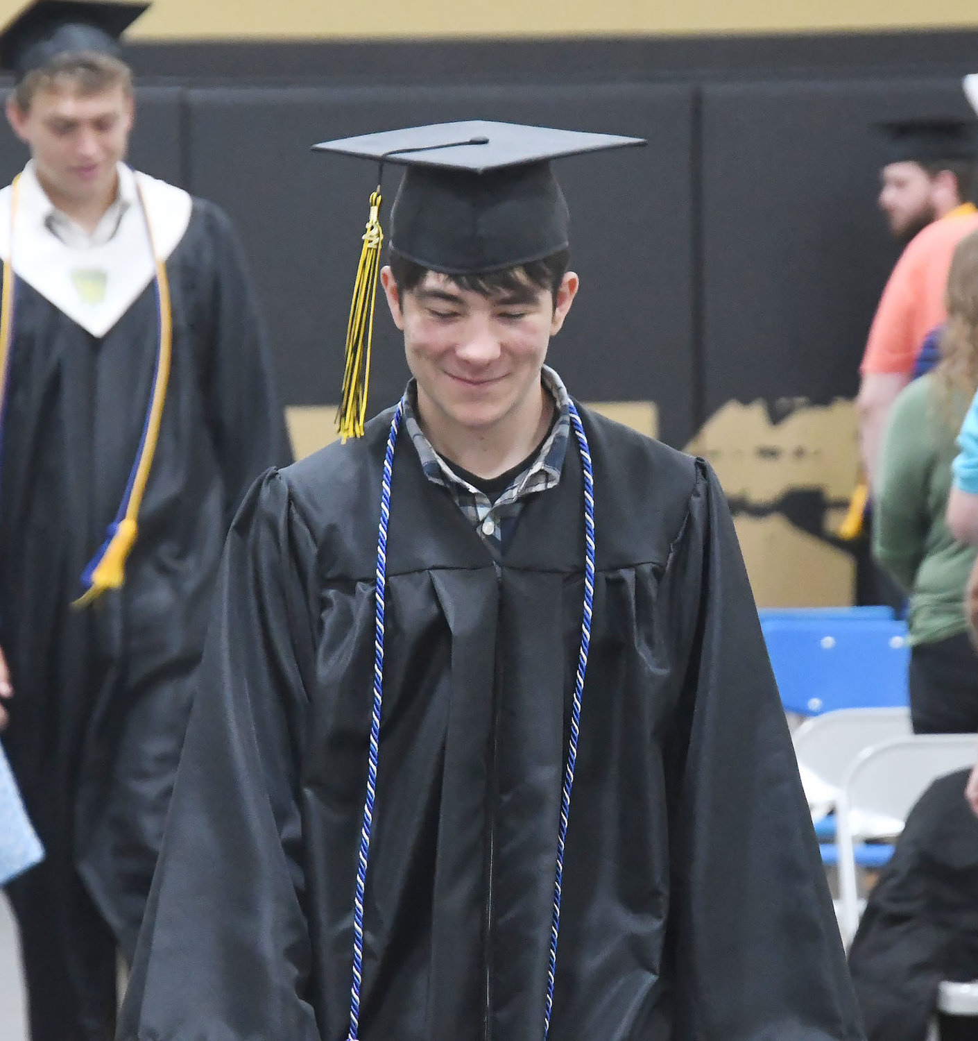 Cairo High School Class of 2022 graduate Zachary Paschall smiles during the processional before Sunday's commencement exercises in the school gymnasium.