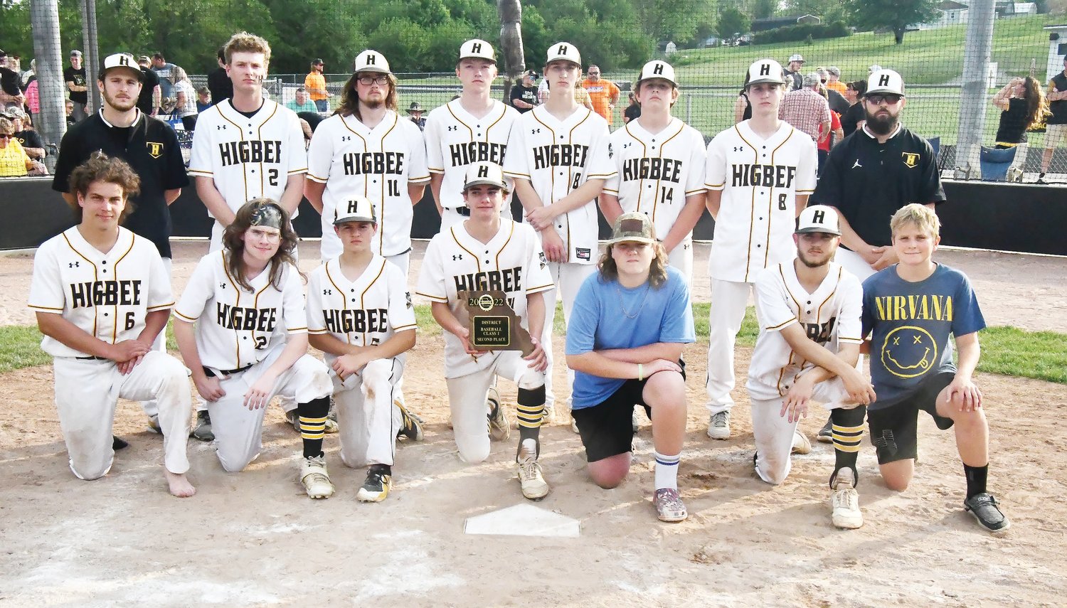 Higbee's baseball team shows off the runner-up plaque it earned after the Class 1 District 12 championship game.