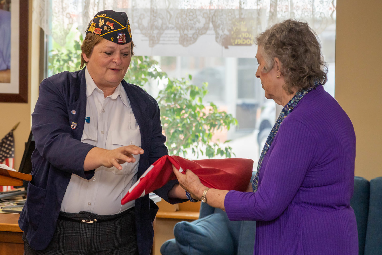 Phyllis Campbell, left, district commander of Post 6 Bazaan Bailey American Legion, presents a five-star flag commissioned by the Legion to Randolph County Historical Society President Joyce Campbell on Armed Forces Day at the museum. The flag honors former Randolph County resident, Gen. Omar Bradley.