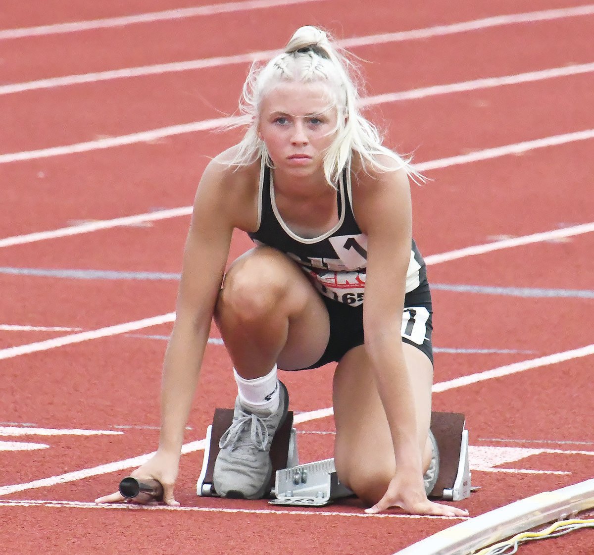Avery Brumley of Cairo prepares to run in the Class 1 girls' 4x100-meter relay last Friday in Jefferson City.