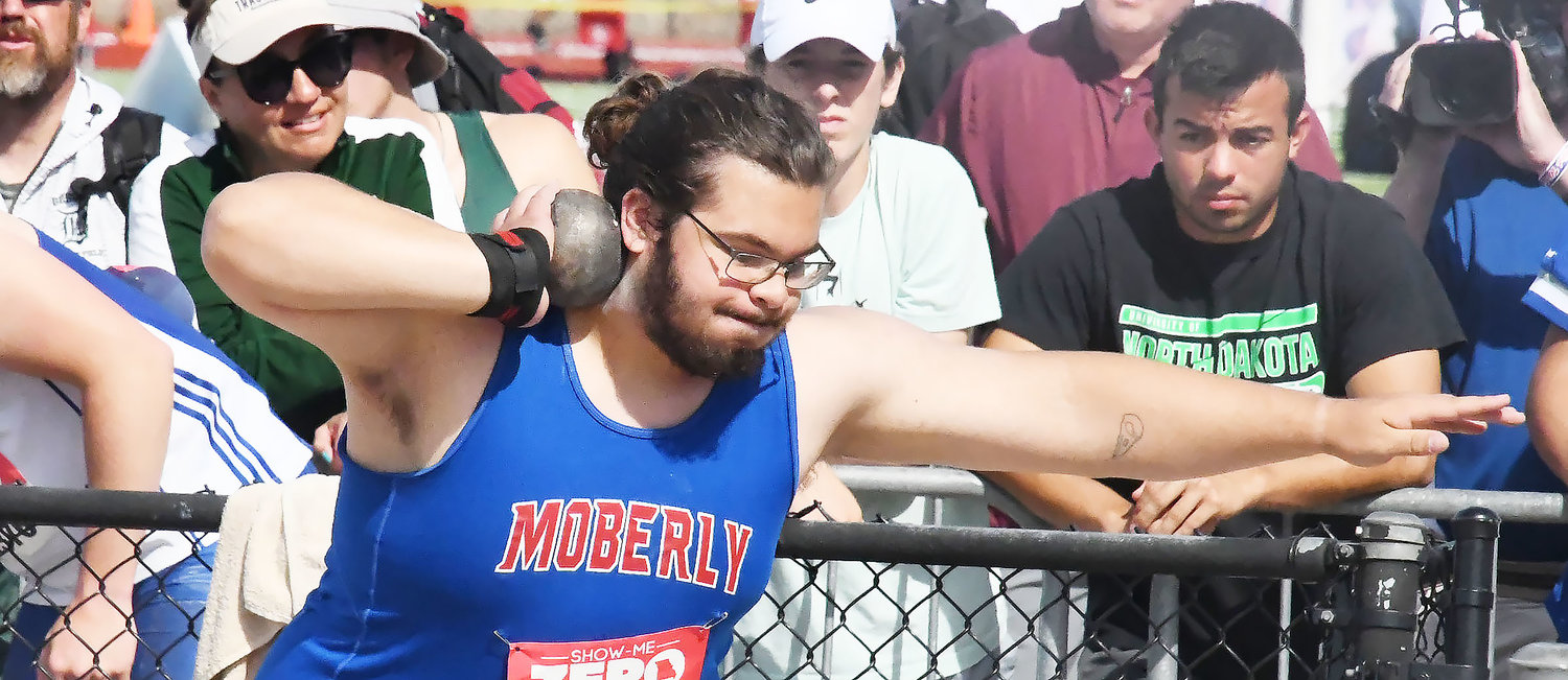 Rick Huff spins through the ring with the shot put during the first flight of the event on Saturday morning at Adkins Stadium in Jefferson City.