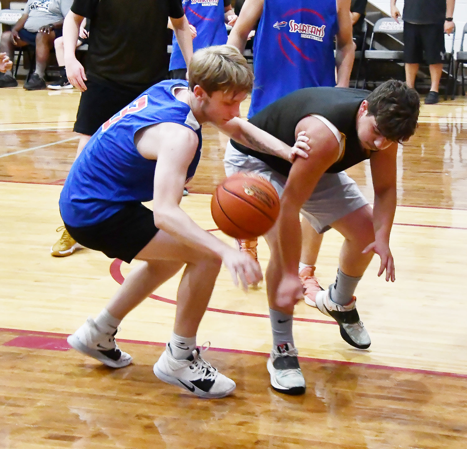 Jonah Black strips the ball from a Smithton player during Monday's scrimmage.
