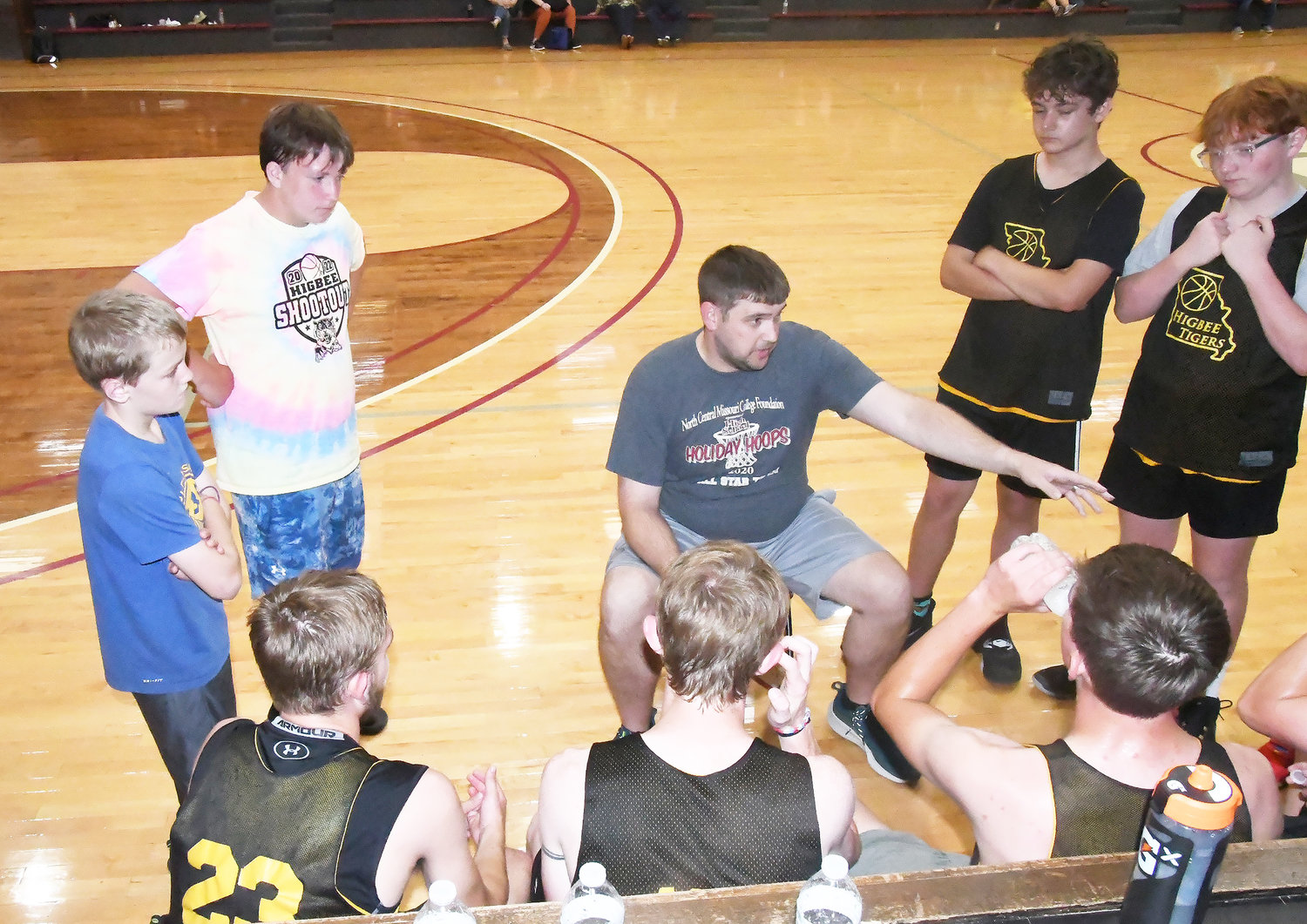 Higbee head coach Tanner Burton makes a point during a timeout in Wednesday's scrimmage at Central Christian College of The Bible.