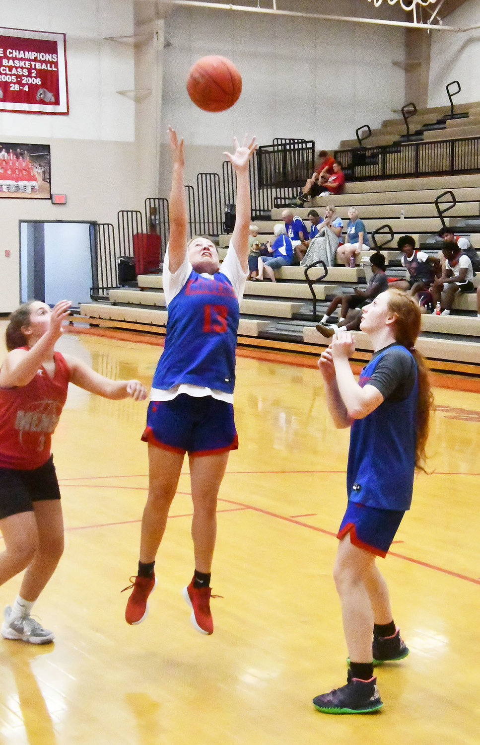 Elizabeth Reisenauer of Moberly grabs a rebound while Haley Baker looks on during the scrimmage versus Mexico.