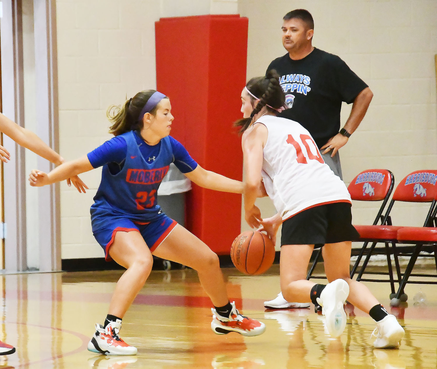 Kennedy Messer of Moberly defends a player from Chillicothe during a Tuesday morning scrimmage.
