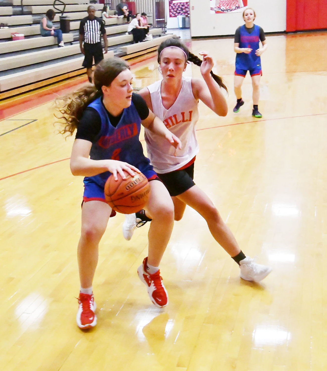 Moberly's Grace Billington, one of the most highly-touted players in north central Missouri, dribbles along the baseline while defended by a player from Chillicothe.
