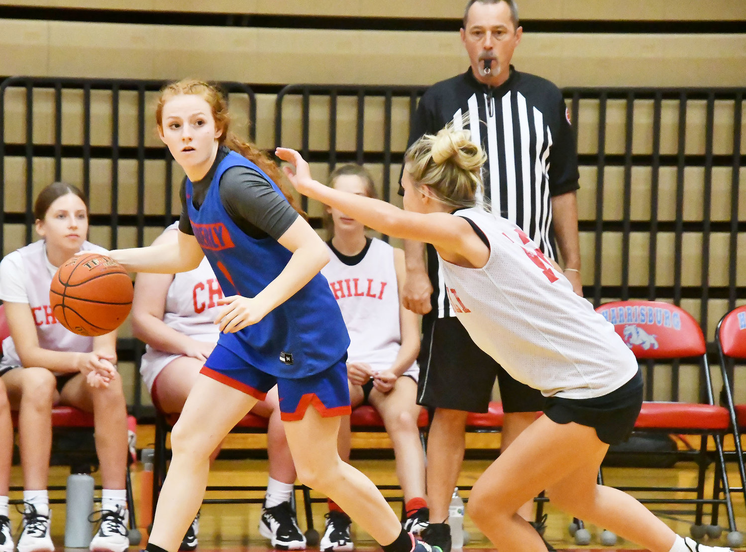 Moberly's Haley Baker attempts to run the Spartans' offense while guarded by Chillicothe.