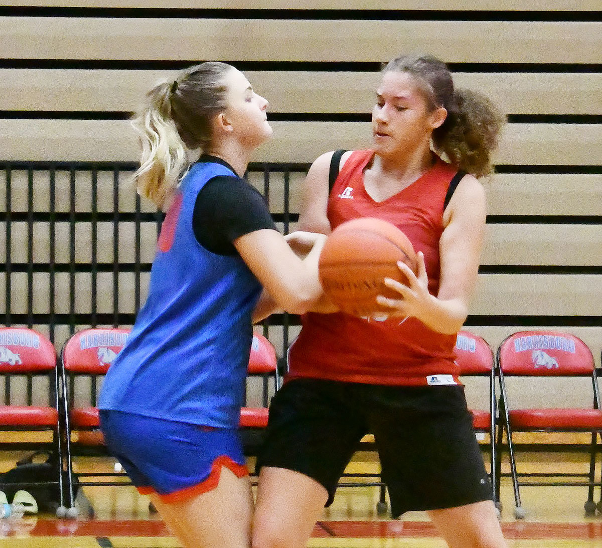 Moberly's Savanna Orscheln bodies up against a player from Mexico as the two North Central Missouri Conference schools squared off in a summer scrimmage Wednesday in Harrisburg.