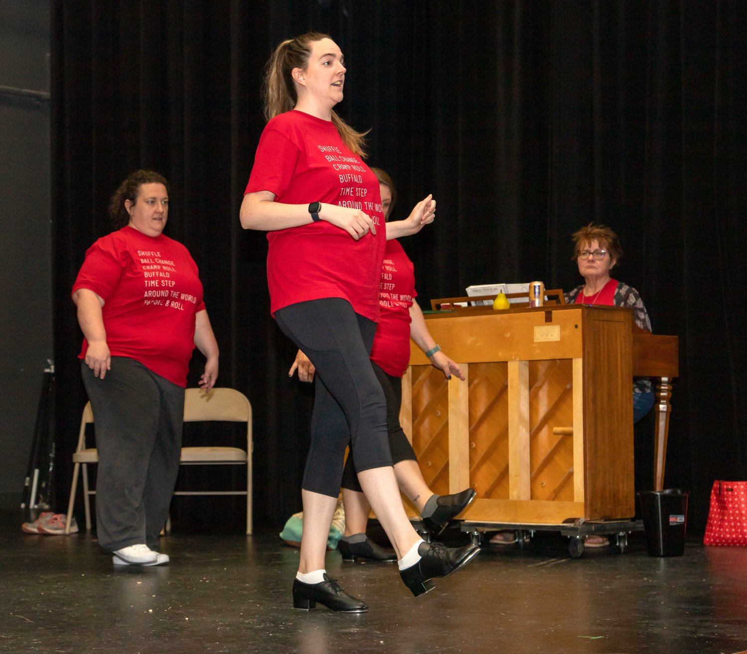 Samantha Boisclair, center, plays dance teacher Tina in the 4th Street Theatre production of “One Night a Week.” Also pictured are Maggie Wright, Erin Shirk and pianist Leah Stein