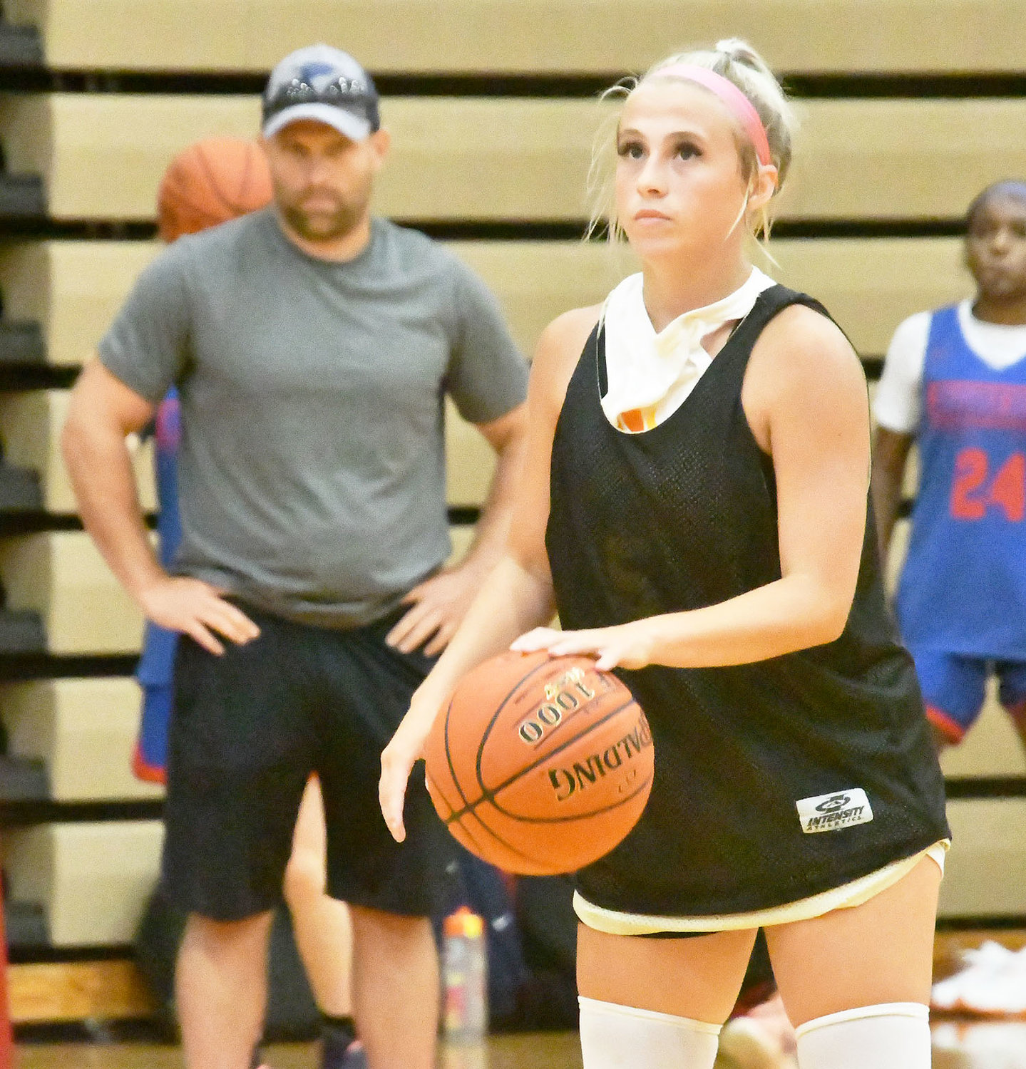 Cairo's Gracie Brumley dribbles and watches the scoreboard clock at the same time late during Tuesday's scrimmage versus Hermann.