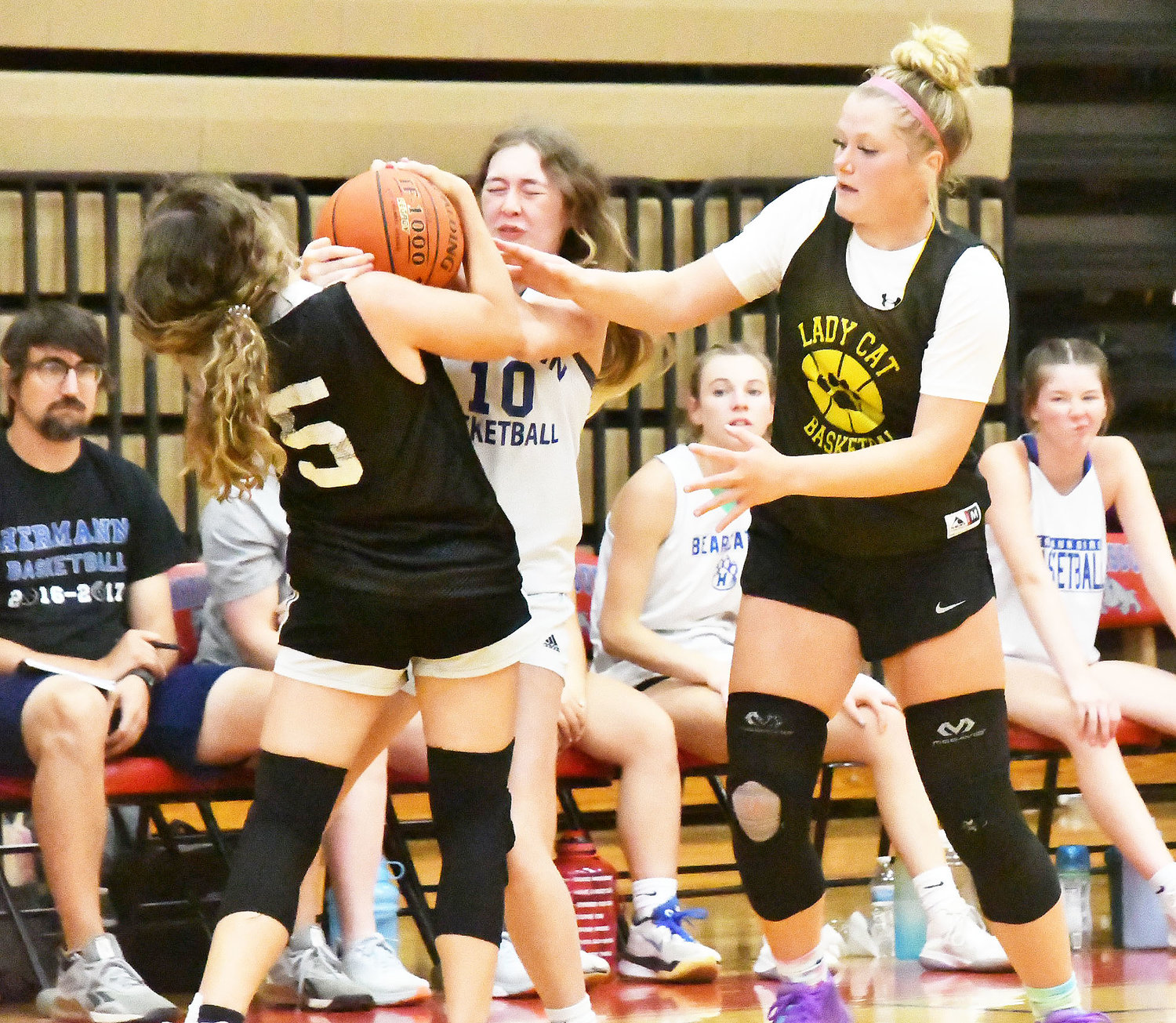 Olivia Cross and Avery Martin play stout double-team defense against Hermann.