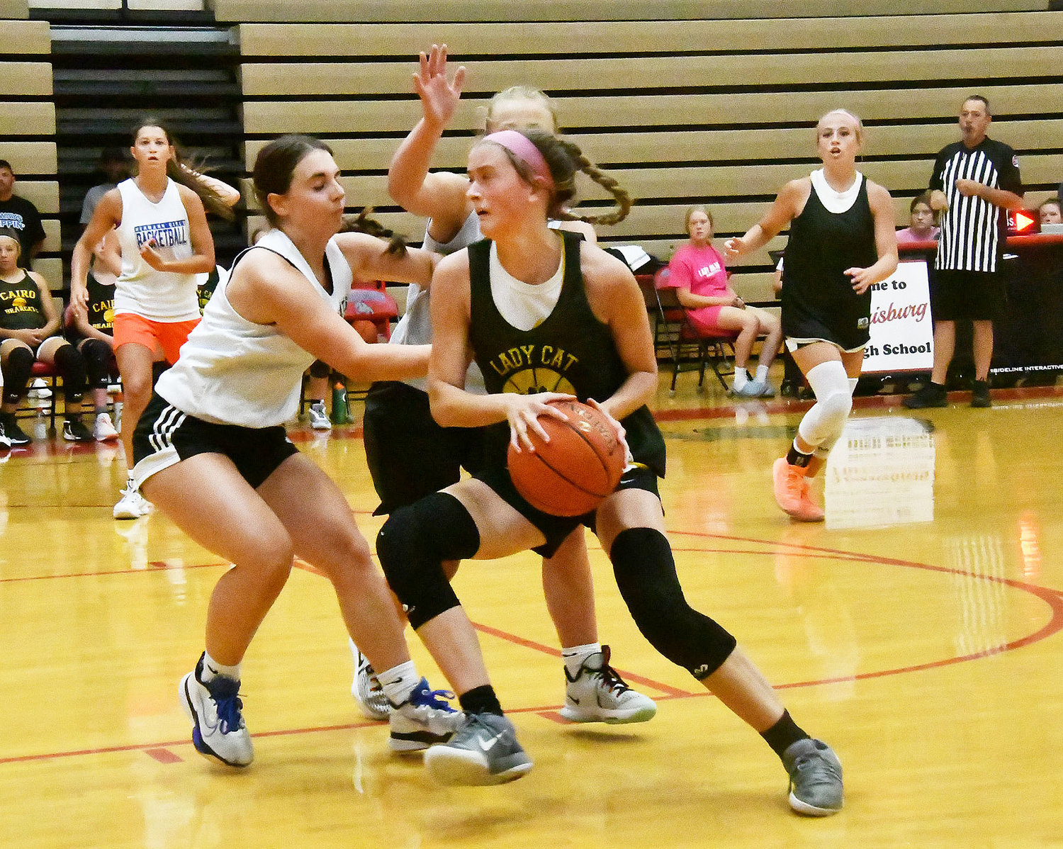 Cairo's Jersey Bailey deals with double-team defense from Hermann during Tuesday's scrimmage at Harrisburg High School.