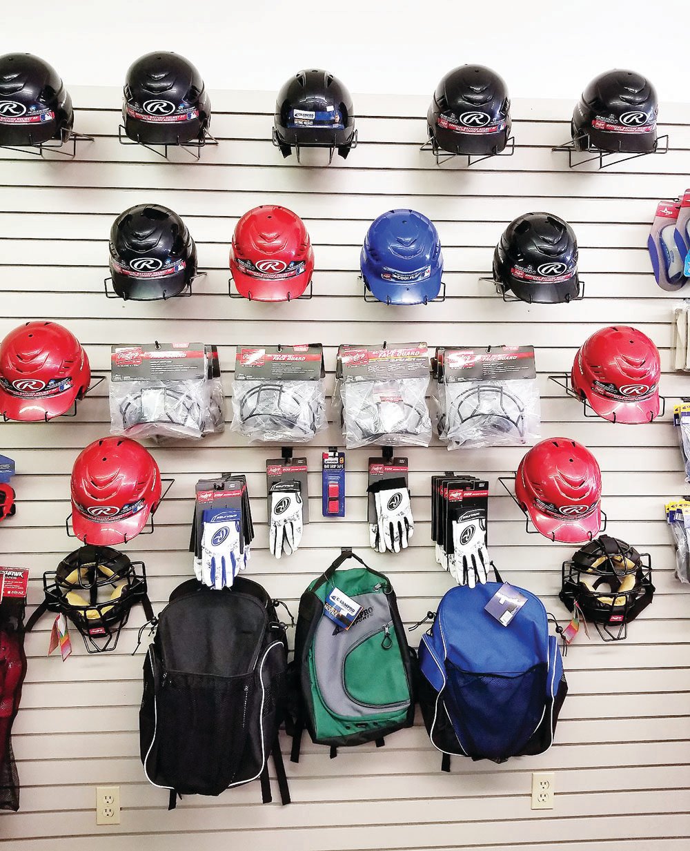 Championship Sports provided consumers with top-of-the line merchandise, including these Rawlings-brand helmets and batting gloves plus backpacks to carry gear for either softball or baseball. There also was an assortment of catcher's masks.