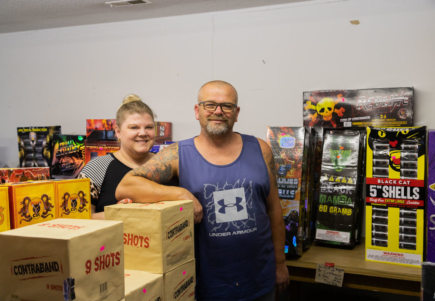 Christy and Chris Bates stand among the fireworks available at ST. Fireworks this season. Formerly working in the background with owner Nate Gerhard, the Bateses are managing one of his locations this summer.