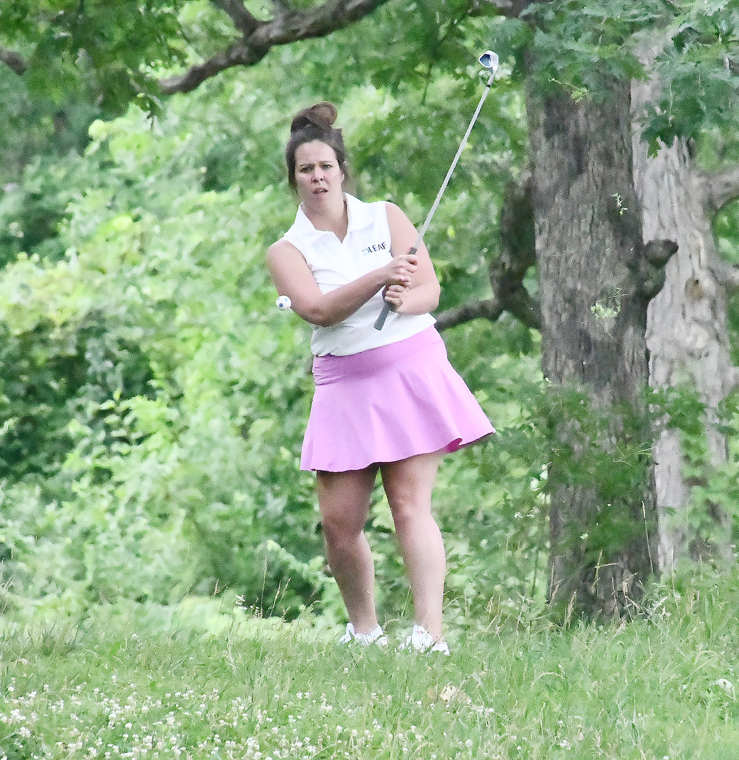 Felicia Bowden, from Team Leaf, hits her second shot from thick rough at Heritage Hills Golf Course.