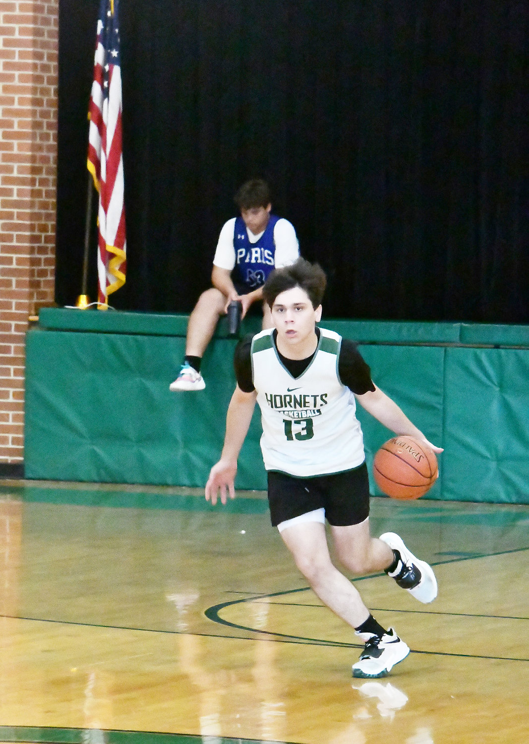 Junior Jace Chapman dribbles up court during a scrimmage in Huntsville on Tuesday, June 28.
