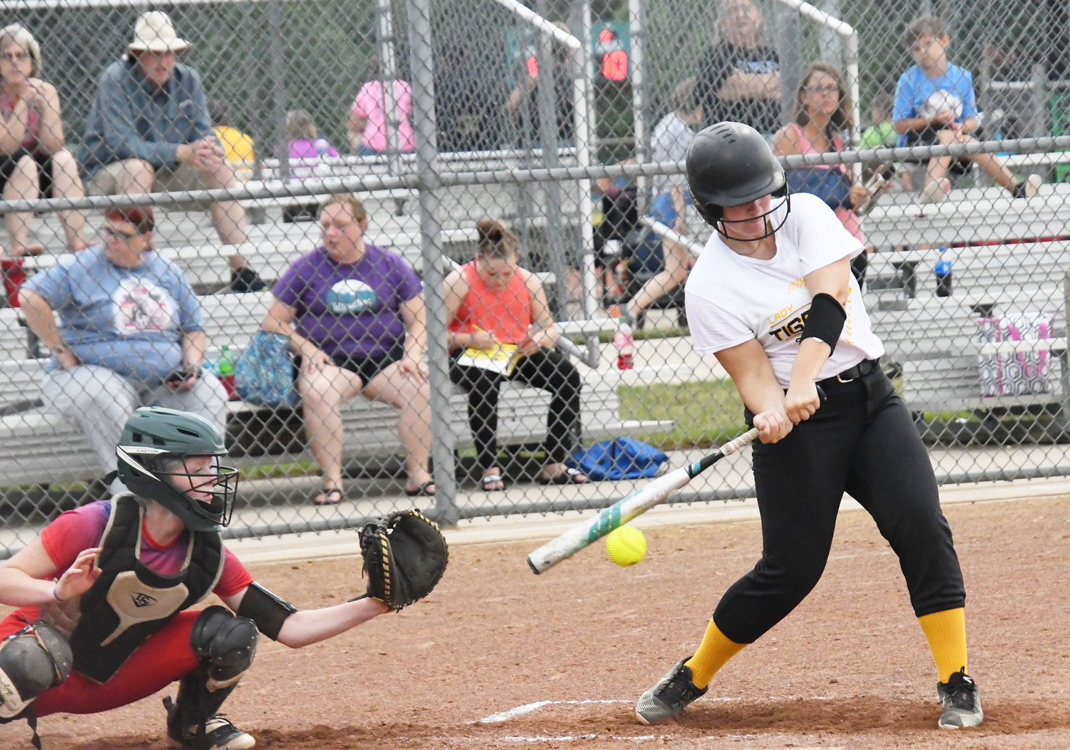 Higbee's Kylleen Gibson makes contact with the ball during a summer league game against the Lady Misfits.