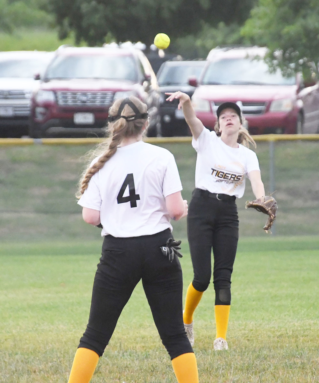 Raegan Derboven throws the ball toward the infield during a defensive relay.