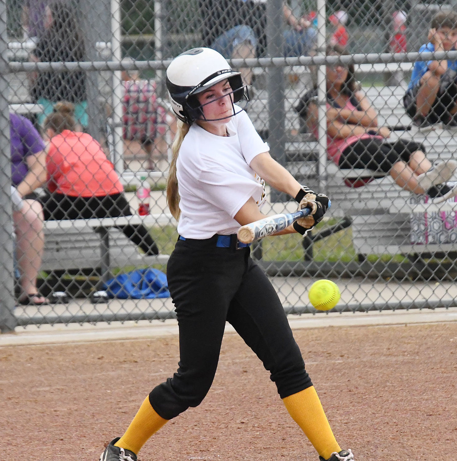 Shelby Bailey hits the ball down the first-base line for a triple during Thursday's game.