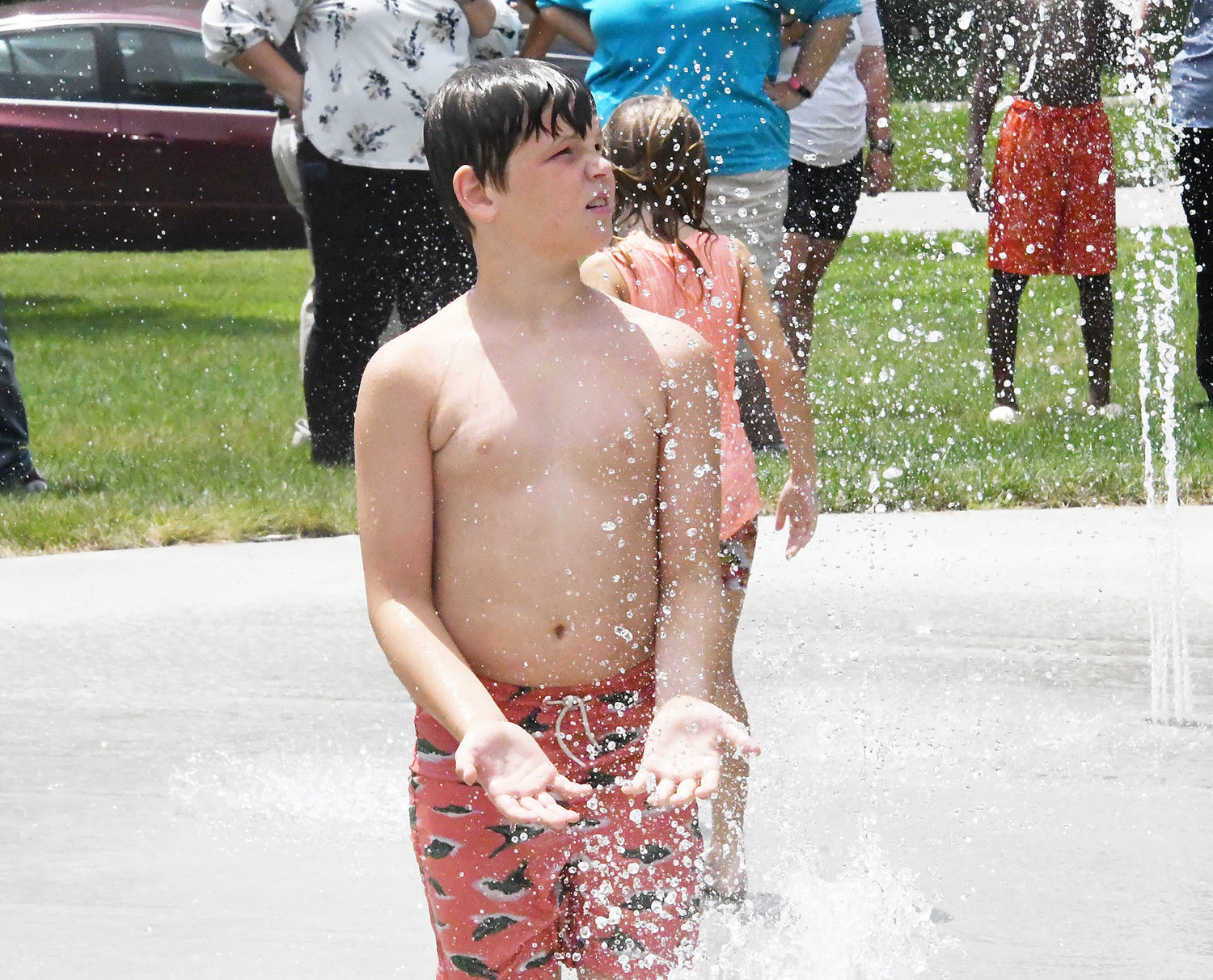 A youngster enjoys one the splashing ground features at Tannehill Park on Friday, July 8.