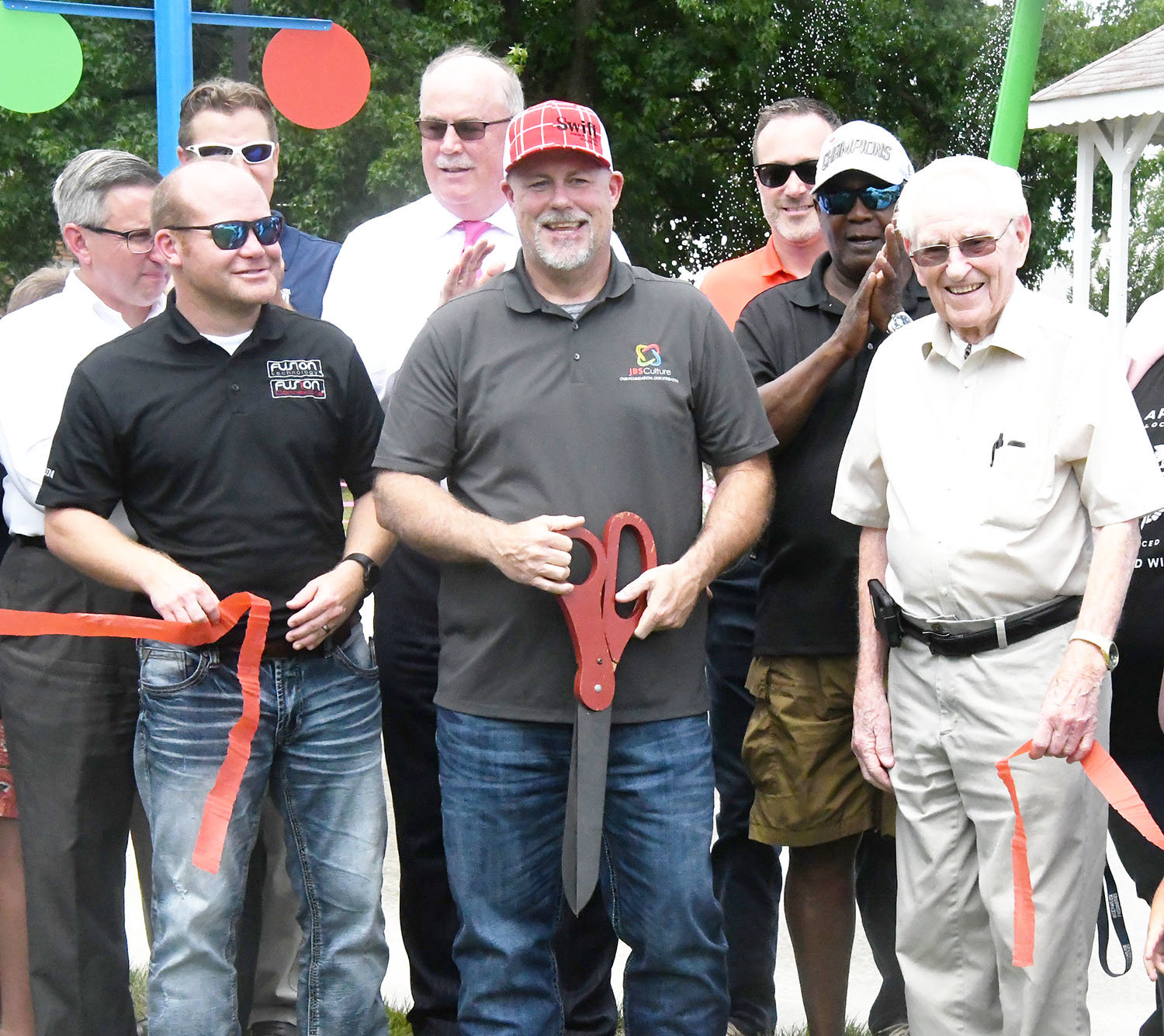 Councilman Brandon Lucas, Joe Machetta from Swift Prepared Foods, Moberly Parks and Recreation Department board members Harley Mattox and Don Hughes, Central Bank's John Meystrik, Moberly city manager Brian Crane, mayor Jerry Jeffrey and insurance broker Brian Skaggs helped cut the ribbon on Friday, July 8.